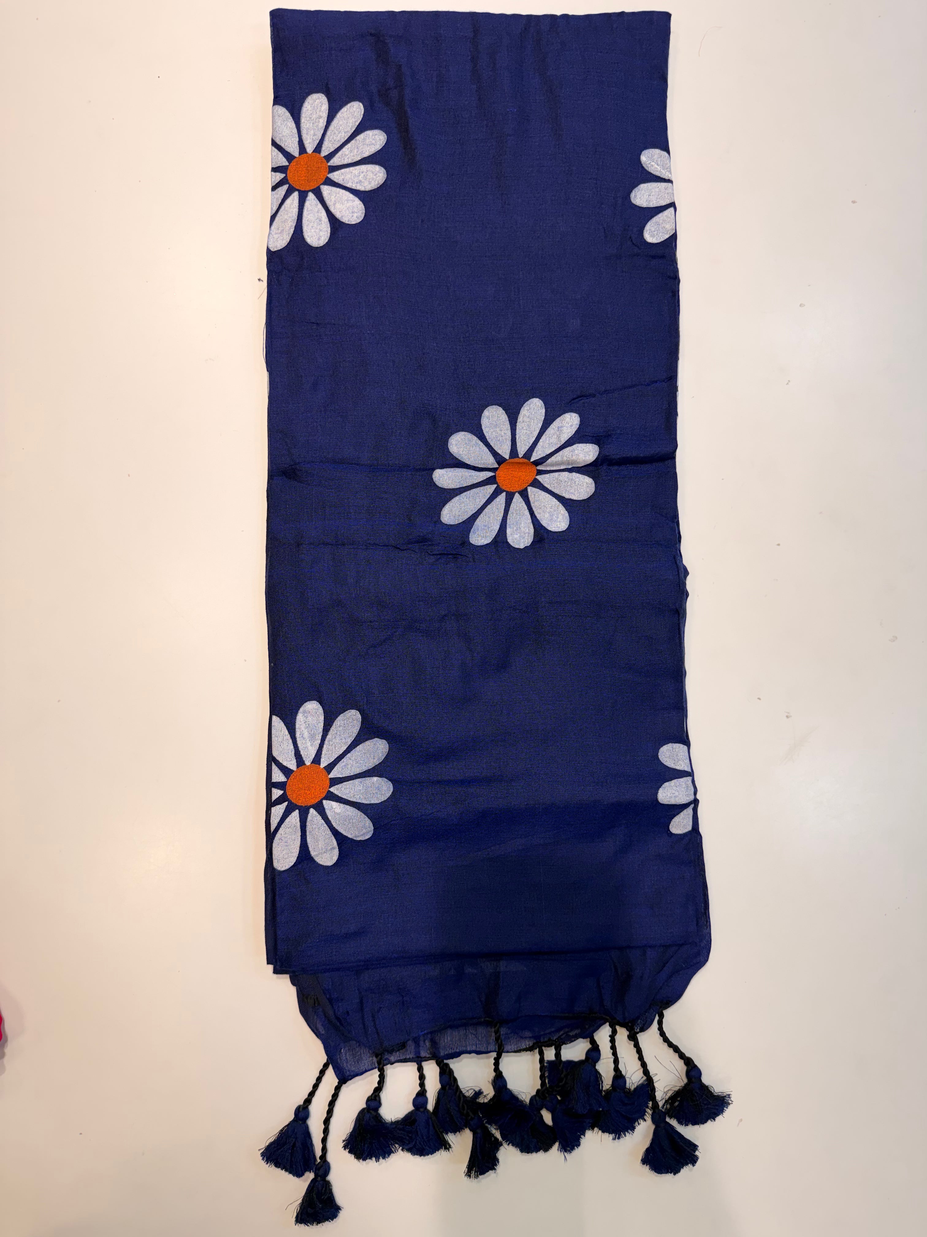 Blue saree with floral patterns.