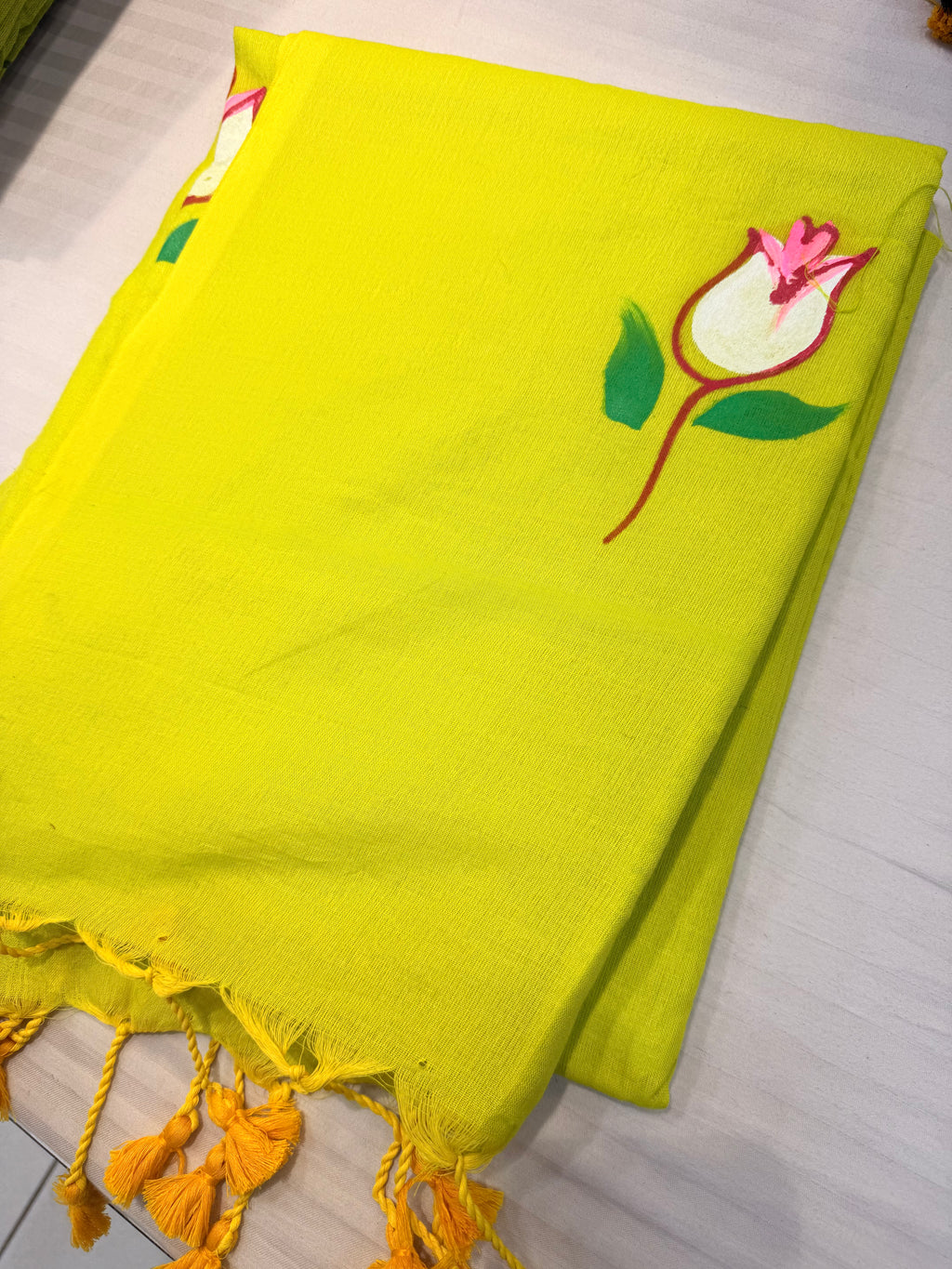 Graceful Pistachio Green Floral Cotton Saree with Tassel Detailing